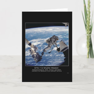 Cartão Astronaut David A. Wolf  transfers the Starboard O