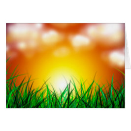 Cartão Belo nascer do sol sobre um campo de grama