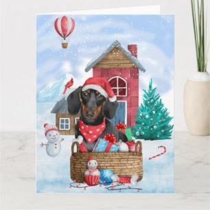 Cartão Cachorro Dachshund na Casa de Natal na Neve