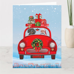 Cartão Cachorro Dachshund no carro com Papai Noel