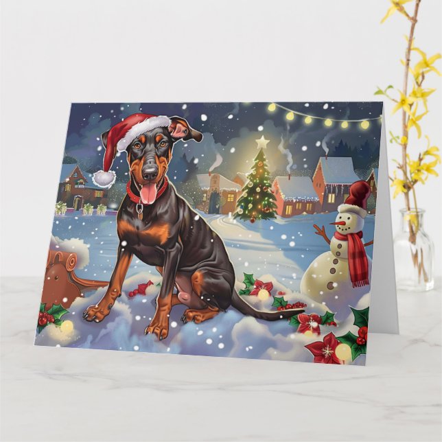 Cartão Cachorro Doberman no Natal da neve em Sleigh (Flor Amarela)