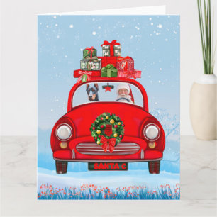 Cartão Cão Doberman no carro com Papai Noel