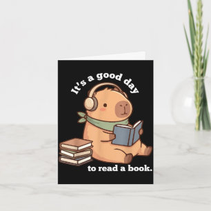 Cartão Capivara engraçada lendo um livro leitura fofa par