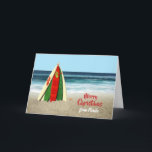 Cartão Christmas card with Surfboards on Beach<br><div class="desc">This is a fun card that I created with some bright and colorful surfboards stacked like a Christmas tree on the beach with a starfish on top and the ocean behind it. All the text on the card front and back is customizable so you can add the holiday greeting you...</div>