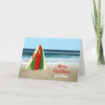 Cartão Christmas card with Surfboards on Beach<br><div class="desc">This is a fun card that I created with some bright and colorful surfboards stacked like a Christmas tree on the beach with a starfish on top and the ocean behind it. All the text on the card front and back is customizable so you can add the holiday greeting you...</div>