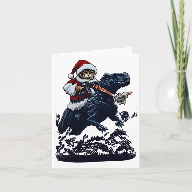 Cartão Christmas Cat In Santa Hat Holding A Gun And Dinos (Frente)