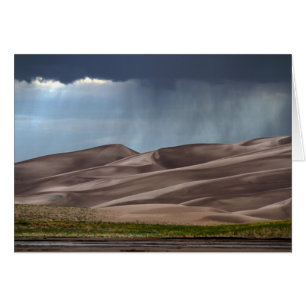 Cartão Chuva nas grandes dunas de areia