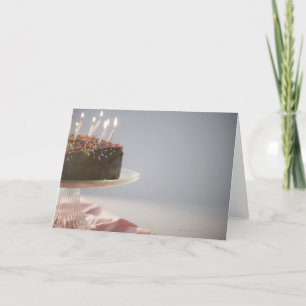 Cartão Close up of chocolate birthday cake with candles