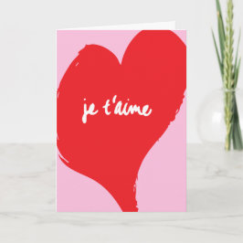 Cartão Coração vermelho com texto je t’aime em fundo rosa