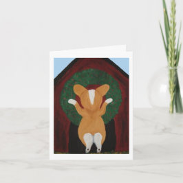 Cartão Corgi colocando Coroa de Natal na Casa do Cachorro