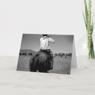 Cartão Cowboy on a horse with two brands.