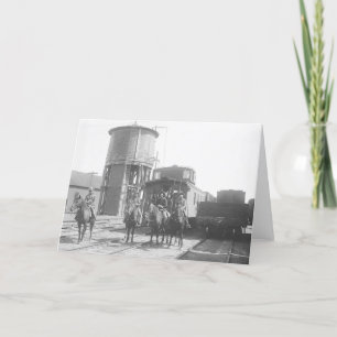 Cartão Cowboys on horses posing in front of a train