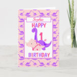 Cartão Crianças primeiro aniversario de Dinossauro Rosa<br><div class="desc">Um cartão de primeiro aniversario divertido. Este brilhante cartão de aniversário apresenta um desenho animado Purple Brontossaurus e um Tricerátops cor-de-rosa, colocado sobre um fundo de dinossauro roxo e rosa Um lindo design para uma menina que terá um ano de idade. A idade de aniversário e o nome da criança...</div>