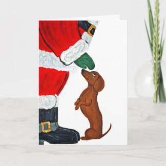 Cartão Dachshund recebendo um presente do Papai Noel