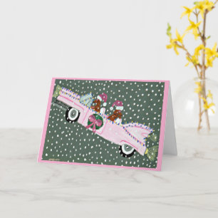 Cartão Dachshunds no Natal em um conversível rosa