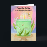Cartão Daughter Happy May Birthday Lily of Valley<br><div class="desc">A whimsical May birthday card for your daughter, where lily of the valley drifts like tiny bells around a softly frosted mint cake, symbolizing joy, innocence, and new beginnings. This hand-painted watercolor glows with blush, lavender, and golden light, with delicate candles and playful garden details adding a sense of wonder....</div>