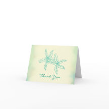 Casal de Estrelas-do-Mar na Praia Obrigado