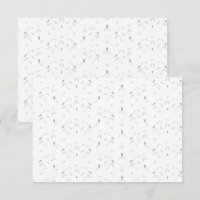 Um padrão decorativo com folhas brancas e cinzas