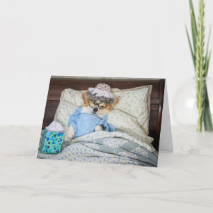 Cartão de cumprimentos em branco com Corgi na cama