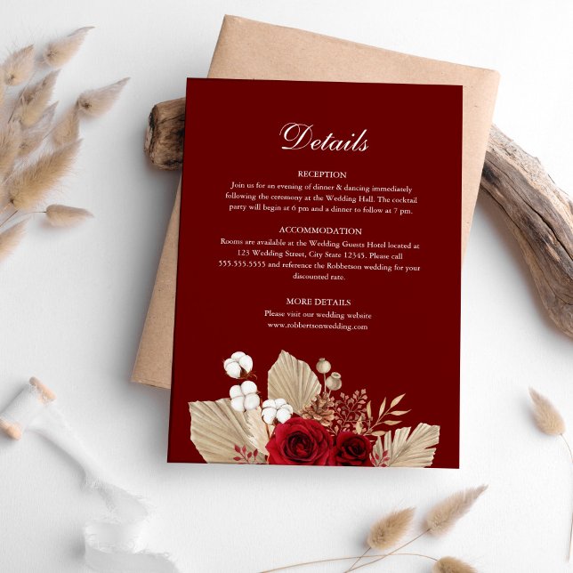 Cartão de Detalhes do Casamento do Jardim Rosa da  (Burgundy Rose Garden Wedding Details Card on table surrounded with pampas grass.)