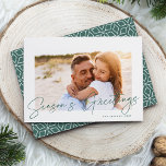 Cartão De Festividades Autograph | Season's Greetings Photo<br><div class="desc">Send holiday greetings to friends and family in chic style with our elegant photo cards. Design features your favorite horizontal or landscape oriented photo framed by a thick white border, with "Season's Greetings" sketched on top in classic evergreen hand lettered script. Personalize with your family name and the year in...</div>