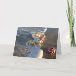 Cartão De Festividades Beach Merry Christmas<br><div class="desc">This beautiful card features a message of "Merry Christmas" and a beautiful beach scene with holiday ornaments,  surf,  and sand.</div>