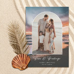 Cartão De Festividades Beach Sunset Painting Seas and Greetings Photo<br><div class="desc">These beautiful holiday photo cards feature a beach sunset painting in the background and an arch shape photo template. Stylish typography reads, "Seas & Greetings." Easy to personalize. The back is a matching dark teal blue but can be customized, if desired. Add photos or choose white for the back so...</div>