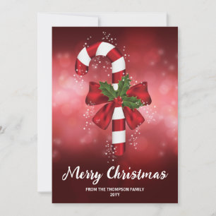 Cartão De Festividades Bengala de Natal Vermelha em um Fundo Bokeh Vermel