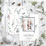 Cartão De Festividades Black Winter Botanical Merry Christmas Photo Holid<br><div class="desc">Apresentando nosso Cartão de Férias de Natal Botânico de inverno Negro! Esta bela carta apresenta a sua foto de família favorita, com Feliz Natal em uma caligrafia popular escrita à mão e duo de fontes serif. É embelezado com preto escuro, vermelho e botânicos verdes de inverno dessaturados. O cartão pode...</div>