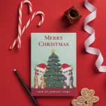 Cartão De Festividades Cachorro de Árvore de Natal de Corgi em Santa Hat<br><div class="desc">Estes lindos cães Pembroke Welsh Corgi têm a cabeça inclinada dentro de um bonitinho chapéu de Papai Noel. Os dois filhotes estão sentados em frente a uma bonito árvore de Natal decorada com ornamentos coloridos. Um belo cartão de férias de corgis com um maravilhoso desenho de um tricolor e um...</div>