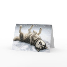 Cachorro Siberiano de Natal Fazendo um Anjo de Nev