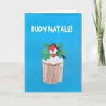 Cartão De Festividades Christmas Card, Italian, Cupcake with Robin<br><div class="desc">A bright and cheerful Italian Christmas Card with a Robin Redbreast perched among holly on top of an iced cupcake, from a handpainted paper collage by Judy Adamson. The front greeting, in white text on a blue background, is 'Joyeux Noel!' and the inside message, which you can change, is, '......</div>