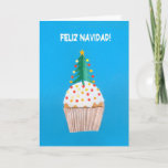 Cartão De Festividades Christmas Card, Spanish, Cupcake, Christmas Tree<br><div class="desc">A Spanish Christmas Card with a decorated Christmas Tree on top of an iced cupcake,  from a handpainted paper collage by Judy Adamson. The front greeting,  in white text on a blue background,  is 'Feliz Navidad!' and the inside greeting,  which you can change,  is '..y un feliz ano nuevo!'.</div>