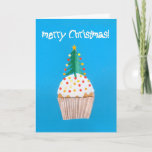 Cartão De Festividades Christmas Cupcake with Christmas Tree<br><div class="desc">A bright and colourful Christmas card with a decorated Christmas Tree on top of an iced cupcake, from a handpainted paper collage design by Judy Adamson. The front greeting, in white text on a bright blue background, is 'Merry Christmas' and the inside text, which you can personalise, is 'and a...</div>