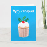 Cartão De Festividades Christmas Cupcake with Holly<br><div class="desc">A bright and colourful Christmas card with a sprig of holly on top of an iced cupcake, from a handpainted paper collage design by Judy Adamson. The front greeting, in white text on a bright blue background, is 'Merry Christmas' and the inside text, which you can personalise, is 'and a...</div>