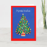 Cartão De Festividades Christmas Tree Card with Finnish Greeting<br><div class="desc">A festive Christmas Card with a Christmas Tree,  made from a handpainted,  paper collage,  and the greeting in Finnish. Please contact me through my store if you would like the front cover text changed (eg to a different language) and the inside is left blank for your own message.</div>