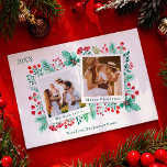 Cartão De Festividades Colagem de Fotos da Família 2 Aquarela de Natal<br><div class="desc">Este cartão de Natal de colagem de fotos da família apresenta duas modelos instantâneas para você inserir suas fotos, com um fundo de folhagem de cor d'água pintada manualmente, como holly, bagas, folhas verdes e florais vermelhos. No verso está um padrão com os mesmos elementos pintados em vermelho e verde....</div>