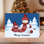 Cartão De Festividades Crafty Snowman a tricotar Scarf<br><div class="desc">Ilustração vetorial de dois adoráveis bonitos bonecos de desenho animado vestidos com chapéus e lenços de malha. O grande boneco de neve está tricotando um cachecol enorme para o pequeno. O cachecol já está envolto várias vezes no bonitinho bonitinho bonitinho bonitinho.</div>