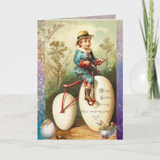 CARTÃO DE FESTIVIDADES CRIANÇA COM BICICLETA DE OVO DE PÁSCOA E FLORES CO