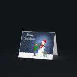 Cartão De Festividades Edifício Snowman<br><div class="desc">O menino construiu um boneco de neve que seu cachorro se sustenta e urina enquanto o menino dá ao boneco de neve um nariz de cenoura.</div>