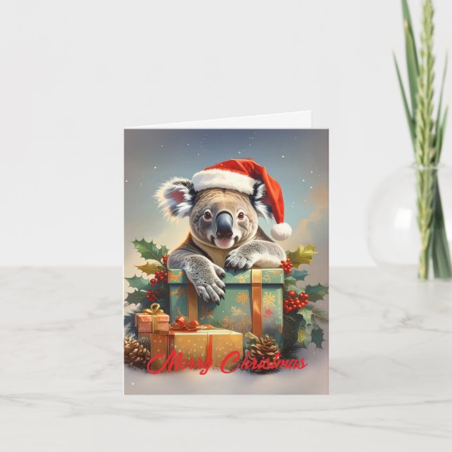 Cartão De Festividades Feliz Natal Coala com presentes e azevinho (Frente)