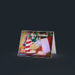 Cartão De Festividades Feliz Natal Papai Noel<br><div class="desc">Cartão de Natal bonito com o Pai Natal a agarrar um biscoito junto com a saudação "Feliz Natal". Use o modelo para adicionar sua mensagem personalizada em vermelho no dentro. Este moderno cartão de Natal não fotográfico é excelente para qualquer pessoa que queira um cartão cartões de natal sem fotografias....</div>