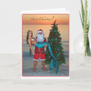 Cartão De Festividades Feliz Sereia de Natal com Papais noeis na Praia