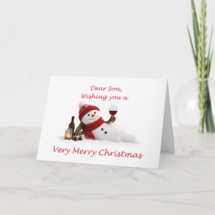 Cartão De Festividades Filho Relaxando com Homem de Neve e Vinho Natal