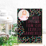 Cartão De Festividades Funny Favorite Grandchild Christmas Lights Photo<br><div class="desc">Fun holiday photo card lettered with "merry christmas from your favorite grandchild" (editable) and decorated with colorful christmas string lights and modern skinny font typography. The photo template is set up for you to add your picture, which is displayed in round format on the front cover. (If you have any...</div>