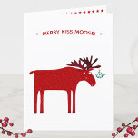 Cartão De Festividades Funny Moose<br><div class="desc">Feliz Kiss Moose Cartão de Natal engraçado, vermelho e branco, com um alce ou alce branco com um monte de conhaque amarrado ao seu chifre, esperando por um beijo apimentado. Altere ou remova a mensagem e adicione seu nome de família ao dentro de saudação para personalizar.</div>