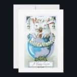 Cartão De Festividades Funny Vintage Easter Bunnies in Egg<br><div class="desc">Whimsical vintage greeting card lithographic art featuring two white Easter bunnies in a dyed blue egg surrounded by lily-of-the-valley and clover with happy Easter greeting.</div>