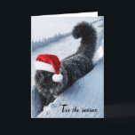 Cartão De Festividades Gato De Natal Em Neve Profunda<br><div class="desc">Um gato preto fofo com flocos de neve e vestindo um chapéu de Papai Noel atravessa um caminho profundo de neve</div>