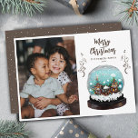 Cartão De Festividades Glass Snowball Winter Village Foto do Natal<br><div class="desc">Vidro Festivo Snowball Winter Village Foto Feliz Cartão Feriado de Natal. O conto de fadas se casa no inverno com neve e belos flocos de neve. Lindas plantas de escalada marrom. Um desejo Feliz de Natal em um roteiro de tendências. Você pode alterar qualquer texto e adicionar sua foto.</div>