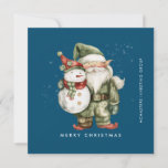 Cartão De Festividades Gnome e Snowman Feliz Natal Comercial Flat<br><div class="desc">Um gnomo vestido de vermelho fica ao lado de um boneco de neve com um chapéu de elfo verde e um cachecol vermelho. Eles estão cercados por uma poeira de neve branca que pop sobre o fundo azul escuro. A estética minimalista é criada por um simples Feliz Natal abaixo e...</div>